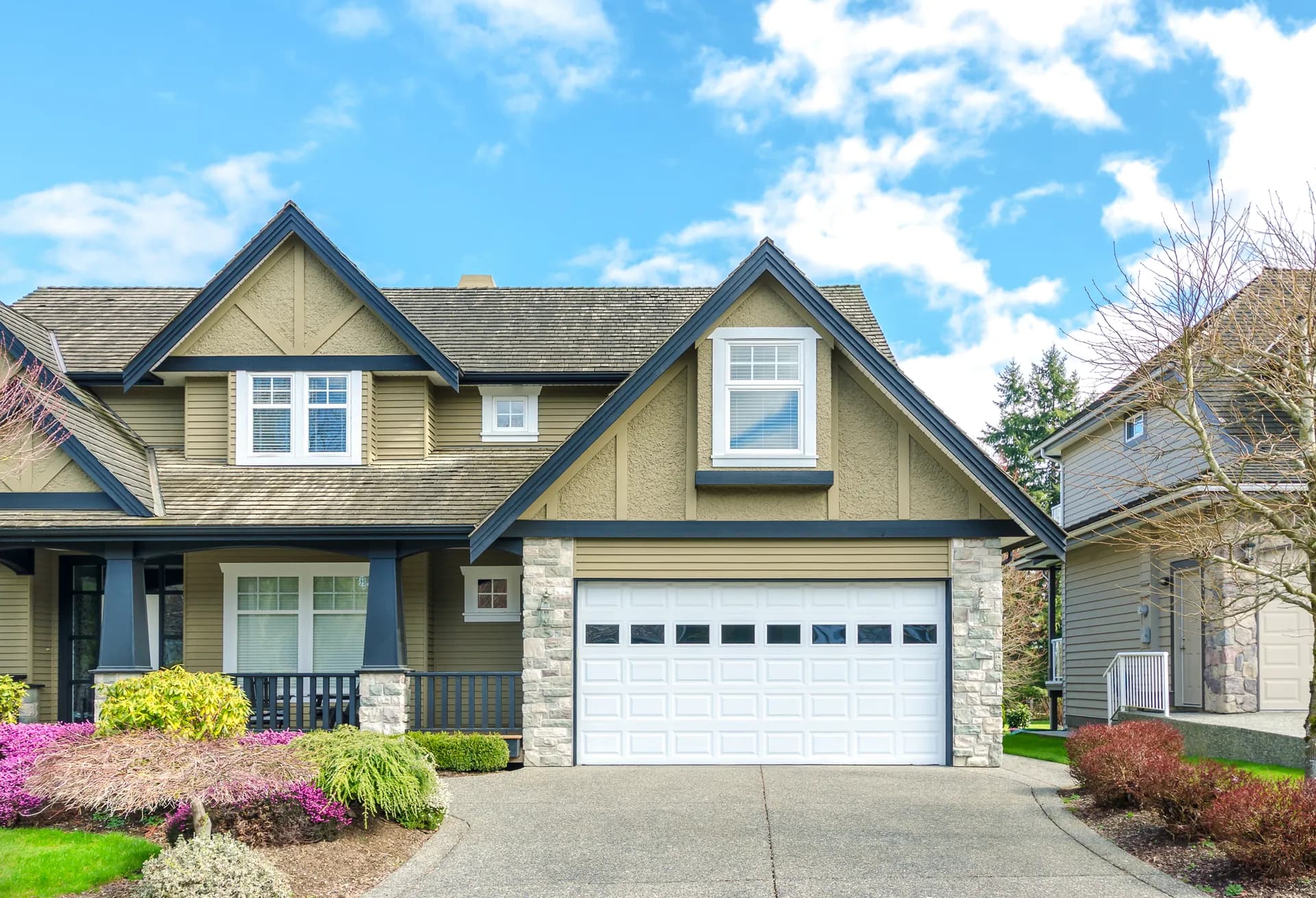 Home exterior with garage — curb appeal after door service
